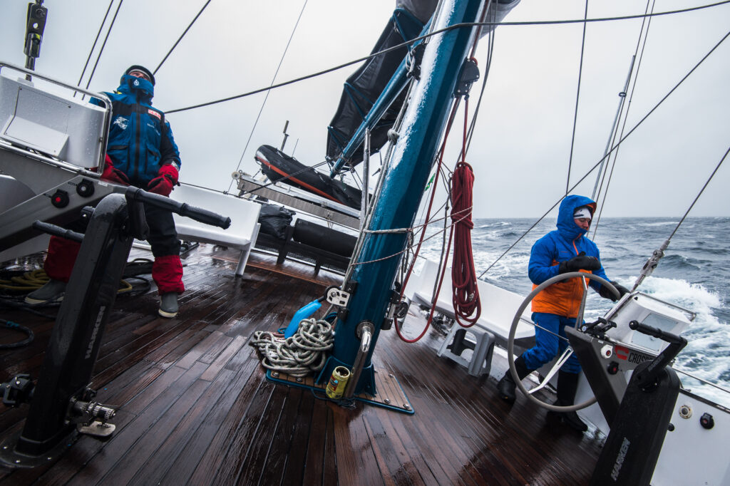 A lone explorer pulling a sled across the Arctic ice.