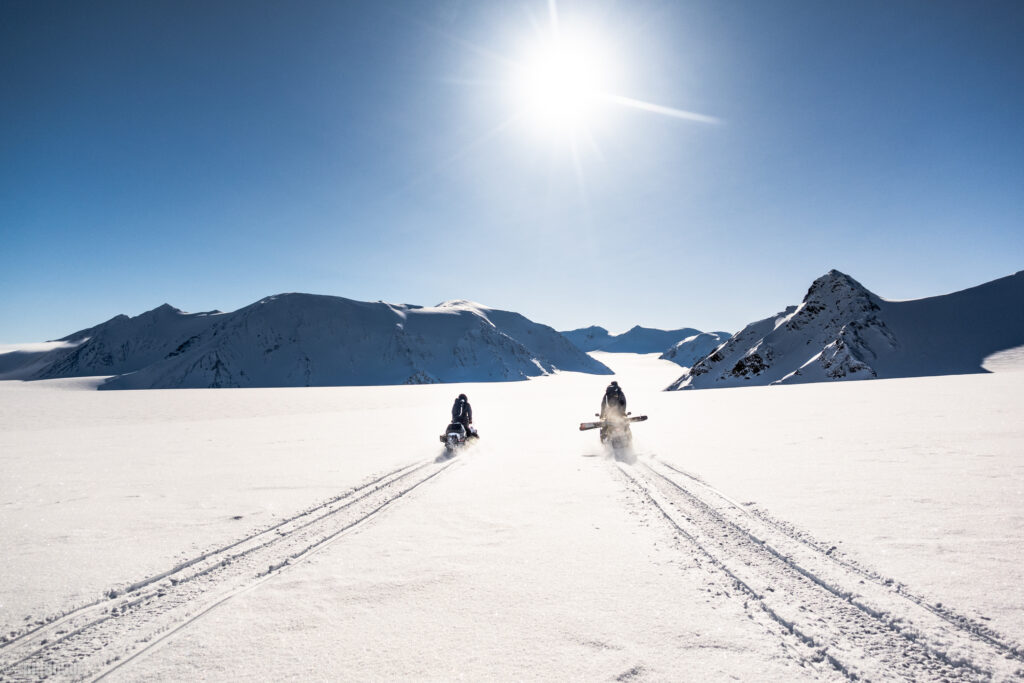 A dynamic Arctic scene featuring ice, snow, and rugged landscapes