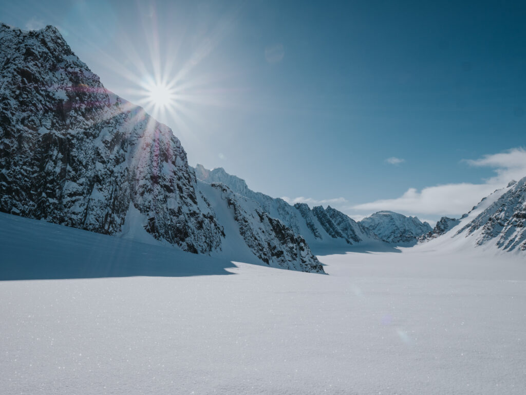 Surrounded by snow and rugged terrain