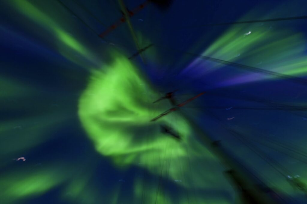 A stunning Arctic landscape showcasing the intersection of skiing and sailing in Greenland.