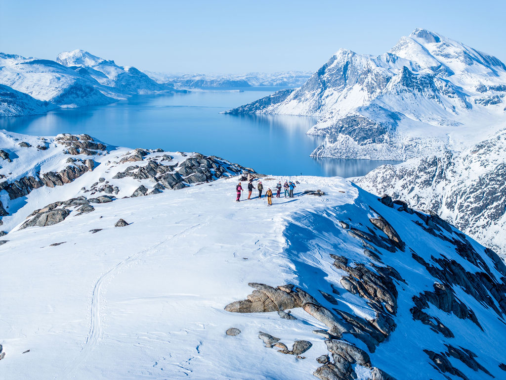 Majestic Arctic scenery with an adventurer moving through the ice.