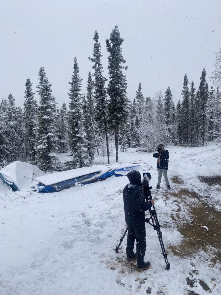 Individual in a heavy winter coat, preparing for icy conditions.
