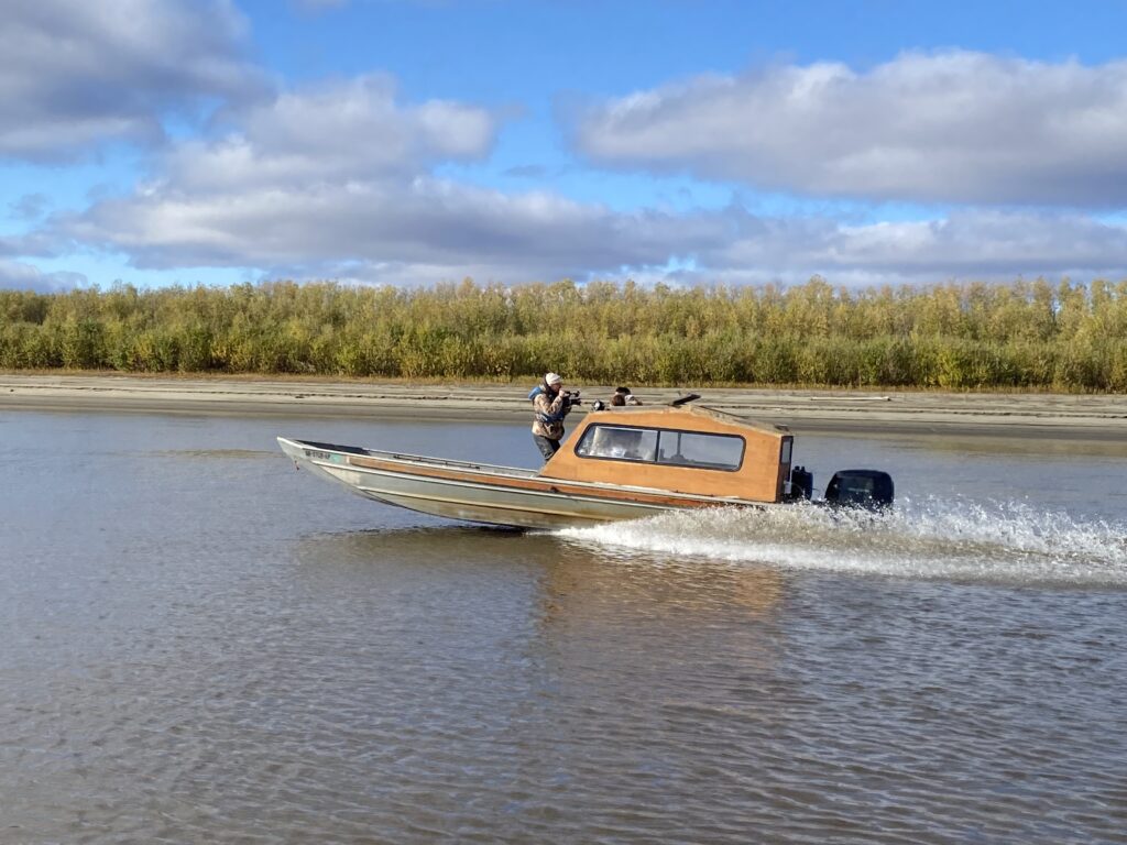 Wide shot of a frozen landscape with snow-covered terrain.