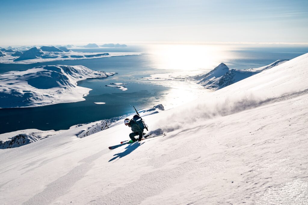 A dramatic Arctic sailing and mountain lifestyle scene captured by Erin Hogue.