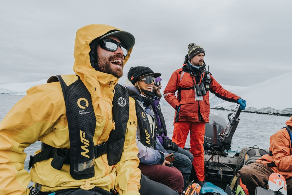 Expedition gear and an explorer navigating an icy Antarctic environment