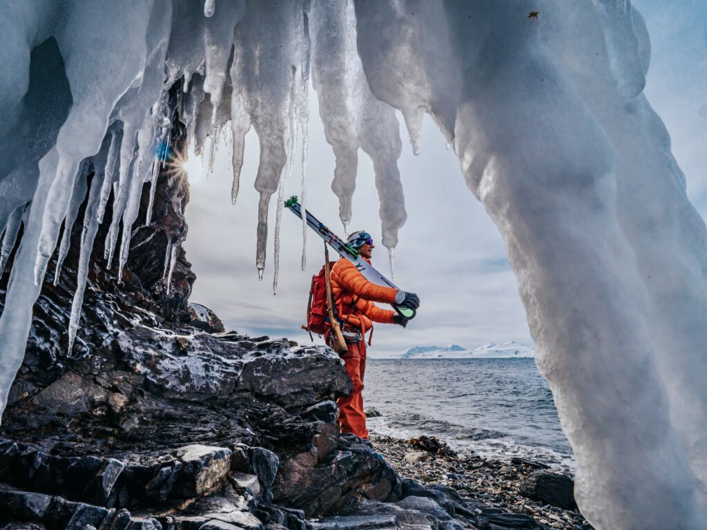 A candid or posed shot of an individual in an outdoor, rugged setting.