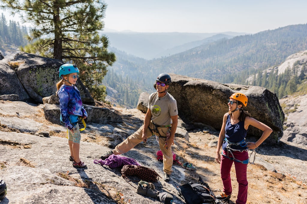 Climber navigating a challenging rock face with focus and determination.