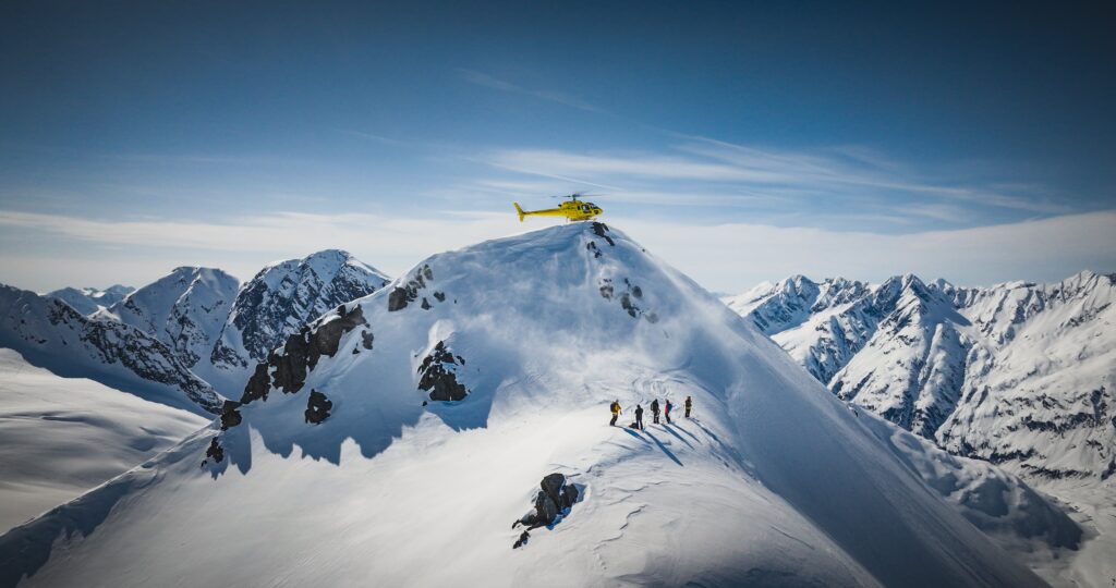 Snow-covered terrain in Antarctica, featuring a lone adventurer.